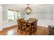 Cozy dining room with hardwood floors and large windows at 1820 Yates Wheel Way, Raleigh, NC 27606