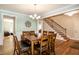 Bright dining room featuring wooden table with seating for six and a stylish chandelier at 1820 Yates Wheel Way, Raleigh, NC 27606