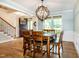 Dining room boasts hardwood floors and abundant natural light at 1820 Yates Wheel Way, Raleigh, NC 27606