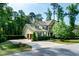 Charming two-story home with well-maintained landscaping, a spacious driveway, and a welcoming facade at 1820 Yates Wheel Way, Raleigh, NC 27606