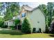 Charming two-story home with manicured lawn and landscaping at 1820 Yates Wheel Way, Raleigh, NC 27606
