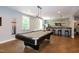 Finished basement game room features a pool table and views of the bar area at 1820 Yates Wheel Way, Raleigh, NC 27606