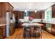 Kitchen featuring a center island with bar stools, stainless steel appliances, and a subway tile backsplash at 1820 Yates Wheel Way, Raleigh, NC 27606
