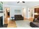 Spacious living room with hardwood floors and seamless flow to other spaces at 1820 Yates Wheel Way, Raleigh, NC 27606