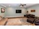 Comfortable sofas and a flat-screen TV creating a relaxing atmosphere in this inviting living room at 1820 Yates Wheel Way, Raleigh, NC 27606