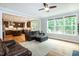 Open-concept living room connects to the kitchen with lots of natural light at 1820 Yates Wheel Way, Raleigh, NC 27606