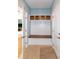 Mudroom area with bench, storage, and hooks at 1820 Yates Wheel Way, Raleigh, NC 27606