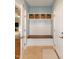 This mudroom features a built-in bench with storage and coat hooks at 1820 Yates Wheel Way, Raleigh, NC 27606
