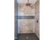 Close up of remodeled shower with decorative tile accent and shower head at 1820 Yates Wheel Way, Raleigh, NC 27606