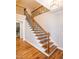 Elegant staircase with wooden steps and wrought iron railing at 1820 Yates Wheel Way, Raleigh, NC 27606