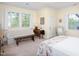 Comfortable bedroom with sitting area near bright windows, and neutral decor at 19 Oak Dr, Durham, NC 27707