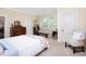 Spacious bedroom with sitting area and hardwood furniture including a dresser and daybed at 19 Oak Dr, Durham, NC 27707
