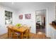Bright dining room features a wood table, light hardwood floors and access to another room at 19 Oak Dr, Durham, NC 27707