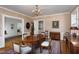 Charming dining room with floral wallpaper, wood table, and period artwork at 19 Oak Dr, Durham, NC 27707