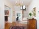 Elegant foyer with hardwood floors, a chandelier, and a staircase, creating a welcoming entrance at 19 Oak Dr, Durham, NC 27707