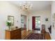 Classic foyer with hardwood floors, a decorative chest, and glimpses into adjacent rooms at 19 Oak Dr, Durham, NC 27707