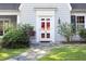 Charming front door with glass panes, classic trim, and a stone pathway leading to the entrance at 19 Oak Dr, Durham, NC 27707
