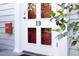Close-up of the front door highlighting the address number and the decorative glass panes at 19 Oak Dr, Durham, NC 27707