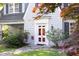 Charming front door with glass panes, classic trim, and a stone pathway leading to the entrance at 19 Oak Dr, Durham, NC 27707