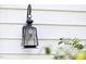 Close-up of a decorative outdoor light fixture mounted on the exterior of the home at 19 Oak Dr, Durham, NC 27707