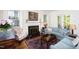 Classic living room features a fireplace, hardwood floors, and neutral-toned furnishings at 19 Oak Dr, Durham, NC 27707