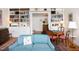 Comfortable living room with bookshelves, a cozy sitting area, and hardwood floors at 19 Oak Dr, Durham, NC 27707