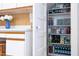 View of an office area with a corkboard, plus a walk-in pantry with multiple shelves at 19 Oak Dr, Durham, NC 27707