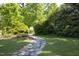 Stone path leading through a manicured lawn at 19 Oak Dr, Durham, NC 27707