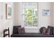Cozy window seat with patterned cushions overlooks the lush outdoors at 19 Oak Dr, Durham, NC 27707