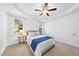 Bright bedroom featuring a tray ceiling, ceiling fan, and natural light at 20 Paddy Ln, Youngsville, NC 27596