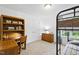 Bedroom featuring a bunk bed, built-in shelves, a desk, and natural light at 20 Paddy Ln, Youngsville, NC 27596