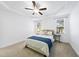 Bright bedroom featuring a tray ceiling, ceiling fan, and natural light at 20 Paddy Ln, Youngsville, NC 27596