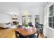 Dining room with an adjacent living area and views to a screened porch at 20 Paddy Ln, Youngsville, NC 27596