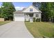 Charming home featuring a one-car garage, well-maintained lawn, and inviting front porch at 20 Paddy Ln, Youngsville, NC 27596