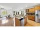 Updated kitchen features granite countertops, wood cabinets, and stainless steel appliances at 20 Paddy Ln, Youngsville, NC 27596