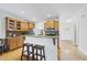 Kitchen features light wood cabinets, granite countertops, and stainless steel appliances at 20 Paddy Ln, Youngsville, NC 27596
