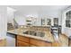 Kitchen featuring a breakfast bar and views into the living and dining areas at 20 Paddy Ln, Youngsville, NC 27596