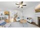Cozy living room boasts hardwood floors, fireplace, and natural light at 20 Paddy Ln, Youngsville, NC 27596