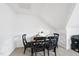 Room features a small table with seating for four and an angled ceiling at 20 Paddy Ln, Youngsville, NC 27596