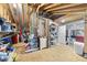 Unfinished attic featuring exposed beams and various household items at 20 Paddy Ln, Youngsville, NC 27596