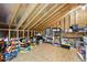 Unfinished attic featuring exposed beams and plenty of storage space at 20 Paddy Ln, Youngsville, NC 27596
