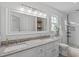 Bathroom features double sinks, granite countertops, and updated shower at 2013 Waterton Ln, Apex, NC 27502