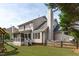 Back exterior view showcasing the architecture and screened porch at 2013 Waterton Ln, Apex, NC 27502