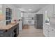 Bright kitchen boasting white cabinetry, stainless steel appliances, and an island for extra counter space at 2013 Waterton Ln, Apex, NC 27502
