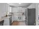Updated kitchen featuring white cabinets, stainless steel appliances, and a functional layout at 2013 Waterton Ln, Apex, NC 27502