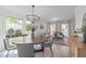 Elegant open-concept space with dining area, modern furnishings, and plenty of natural light at 2013 Waterton Ln, Apex, NC 27502