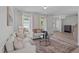 Open-concept living room boasting abundant natural light and stylish furniture arrangement at 2013 Waterton Ln, Apex, NC 27502