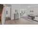 Open-concept living area flows into a dining space with ample natural light at 2013 Waterton Ln, Apex, NC 27502
