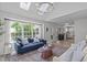 Airy living room with ample sunlight, opens to the kitchen and boasts stylish furniture at 2013 Waterton Ln, Apex, NC 27502