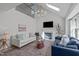 Bright living room boasts vaulted ceilings, a fireplace, and a cozy seating arrangement at 2013 Waterton Ln, Apex, NC 27502